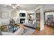 Spacious living room open to dining and kitchen, with hardwood floors and a fireplace at 4203 Overcup Oak Ln, Cary, NC 27519