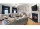 Inviting living room featuring hardwood floors, a fireplace, and comfortable seating at 4203 Overcup Oak Ln, Cary, NC 27519