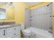 Bright bathroom with tiled shower, vanity with countertop, and modern fixtures at 4305 Lake Ridge Dr, Raleigh, NC 27604