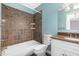 Nicely-done bathroom with white vanity and tiled shower/bath featuring stylish fixtures at 4305 Lake Ridge Dr, Raleigh, NC 27604