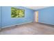 Spacious bedroom with natural light from the window and access to an ensuite bathroom at 4305 Lake Ridge Dr, Raleigh, NC 27604