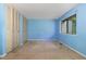 Bedroom featuring built-in closets and a window providing natural light at 4305 Lake Ridge Dr, Raleigh, NC 27604
