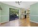 Bright dining area with sliding glass doors to backyard, adjacent to kitchen with wood cabinets at 4305 Lake Ridge Dr, Raleigh, NC 27604