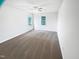 Spacious bedroom features soft carpet, neutral walls, and double windows providing great natural light at 5356 Baywood Forest Dr, Knightdale, NC 27545