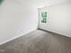 Empty bedroom featuring soft carpeting and a bright window at 5356 Baywood Forest Dr, Knightdale, NC 27545