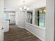 Bright dining area featuring modern lighting and a large window overlooking the backyard at 5356 Baywood Forest Dr, Knightdale, NC 27545