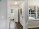 Well-lit hallway features stylish flooring, access to outdoor deck, and a bright airy feel at 5356 Baywood Forest Dr, Knightdale, NC 27545