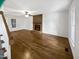 Bright living room featuring gleaming hardwood floors, fireplace, and lots of natural light at 5356 Baywood Forest Dr, Knightdale, NC 27545