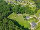 Aerial view of a home and a fenced pasture at 545 Olivia Way, Selma, NC 27576