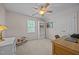 Neutral bedroom showcasing a writing desk and chair, bookcase, and rocking horse at 545 Olivia Way, Selma, NC 27576