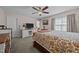 Comfortable bedroom featuring a ceiling fan and television with decorative accents at 545 Olivia Way, Selma, NC 27576