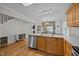 Bright kitchen with stainless steel dishwasher, wooden cabinets, and an open layout at 545 Olivia Way, Selma, NC 27576