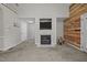 Open concept living room with wood accent wall, vaulted ceiling and fireplace at 545 Olivia Way, Selma, NC 27576
