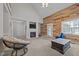 This large living room has a fireplace, wood accent wall, vaulted ceiling and access to the exterior at 545 Olivia Way, Selma, NC 27576