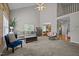 Spacious living room features vaulted ceiling, fireplace, and open access to the eat-in kitchen at 545 Olivia Way, Selma, NC 27576