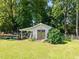 Exterior view of the shed with double doors and a lean-to for storage at 545 Olivia Way, Selma, NC 27576