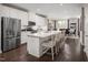 Modern kitchen with stainless steel appliances, white cabinets, and a spacious island at 601 Rockwater Path, Durham, NC 27713
