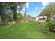 Expansive backyard featuring green grass and mature trees at 606 E Club Blvd, Durham, NC 27704
