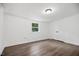 This bedroom offers laminate floors, a flush mount light and double door closet at 606 E Club Blvd, Durham, NC 27704