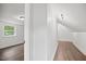 Hallway with wood-look flooring has access to bedroom at 606 E Club Blvd, Durham, NC 27704