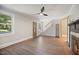 Spacious living room featuring hardwood floors, fireplace, and an open staircase, filled with natural light at 606 E Club Blvd, Durham, NC 27704