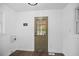 Bright mud room features a rear door with glass and laundry hookups at 606 E Club Blvd, Durham, NC 27704