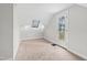 Finished attic with carpeted floors, sloped ceilings, and door leading to outside deck at 625 New Road Rd, Raleigh, NC 27608