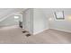 Finished attic room with carpeted floors, sloped ceilings and a ceiling fan at 625 New Road Rd, Raleigh, NC 27608