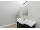 Bathroom features a white sink on a dark cabinet with chrome faucet and hardware at 625 New Road Rd, Raleigh, NC 27608