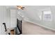 Spacious bonus room featuring built-in shelving and a ceiling fan for added comfort at 625 New Road Rd, Raleigh, NC 27608