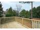 View from the wood deck to the lush, green, tree filled back yard at 625 New Road Rd, Raleigh, NC 27608