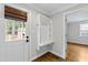 Mudroom featuring a built in drop station and hardwood flooring at 625 New Road Rd, Raleigh, NC 27608
