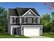 Charming two-story home with a classic design, complemented by a well-maintained lawn and an attached two-car garage at 69 Willow Cameron Way, Angier, NC 27501