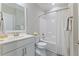 Bright bathroom featuring a tub with shower, modern fixtures, and neutral color palette at 705 Churton Pl, Cary, NC 27518