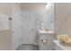Neutral bathroom featuring vanity, framed mirror, toilet, and gray tile flooring at 705 Churton Pl, Cary, NC 27518