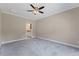 Spacious bedroom featuring neutral walls, carpet flooring, and attached bathroom at 705 Churton Pl, Cary, NC 27518