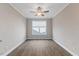 Bedroom featuring a window and flooring at 705 Churton Pl, Cary, NC 27518