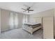 Comfortable bedroom with soft carpet, ceiling fan, and a large bed, creating a relaxing retreat at 705 Churton Pl, Cary, NC 27518