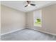Neutral bedroom featuring gray carpet, a ceiling fan, and a window at 705 Churton Pl, Cary, NC 27518