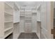 This walk-in closet has built-in shelves, drawers, and hanging rods for storage at 705 Churton Pl, Cary, NC 27518