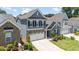Two-story home with a two-car garage, stone accents, and beautiful curb appeal at 705 Churton Pl, Cary, NC 27518