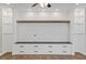 Contemporary living room featuring built-in storage, shelving, and neutral finishes at 705 Churton Pl, Cary, NC 27518