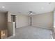 Spacious loft area with neutral carpet, recessed lighting, and a ceiling fan, perfect for a versatile living space at 705 Churton Pl, Cary, NC 27518