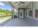 A roomy screened porch boasts neutral flooring, calming gray walls, and views of the fenced yard at 705 Churton Pl, Cary, NC 27518