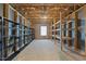 Spacious unfinished basement with exposed wood beams and rafters, providing ample storage or customization potential at 705 Churton Pl, Cary, NC 27518