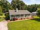 Inviting ranch-style home featuring a covered front porch and a well-maintained lawn at 73 Richmond Dr, Archer Lodge, NC 27527