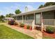 Inviting front porch with cozy decor, a welcome mat, and a glimpse of the lush front yard at 73 Richmond Dr, Archer Lodge, NC 27527