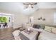 Bright living room with vaulted ceilings, neutral tones, and view into adjacent kitchen at 73 Richmond Dr, Archer Lodge, NC 27527