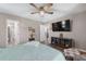Spacious bedroom with neutral tones, with connecting view of bathroom, walk-in closet, and kitchen at 73 Richmond Dr, Archer Lodge, NC 27527