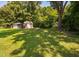 Backyard storage shed and caged dog run at 73 Richmond Dr, Archer Lodge, NC 27527